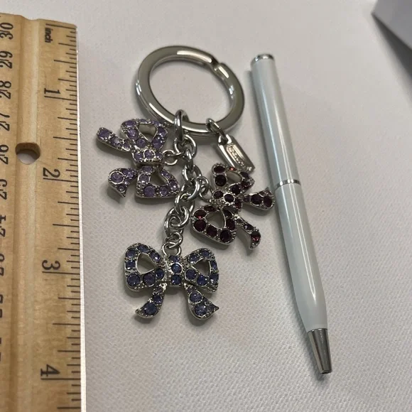 Elegant Coach Bow Keychain with Multicolor Crystals and a White Coach Pen - Picture 3 of 6